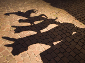 shadow of the sculpture of the famous town musicians of Bremen. "The Town Musicians of Bremen" is a fairy tale from Brothers Grimm.