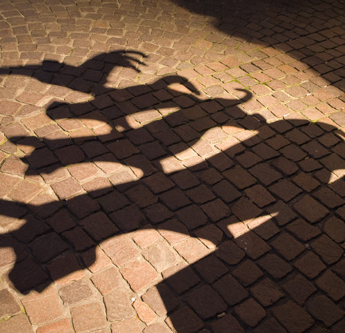 shadow of the sculpture of the famous town musicians of Bremen. "The Town Musicians of Bremen" is a fairy tale from Brothers Grimm.