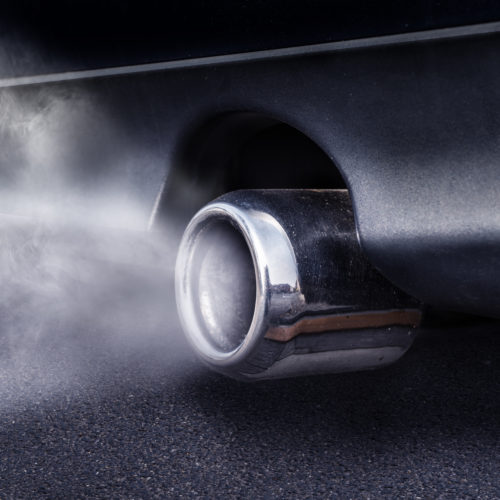 close up of an exhaust pipe which is exhausting carbon dioxide
